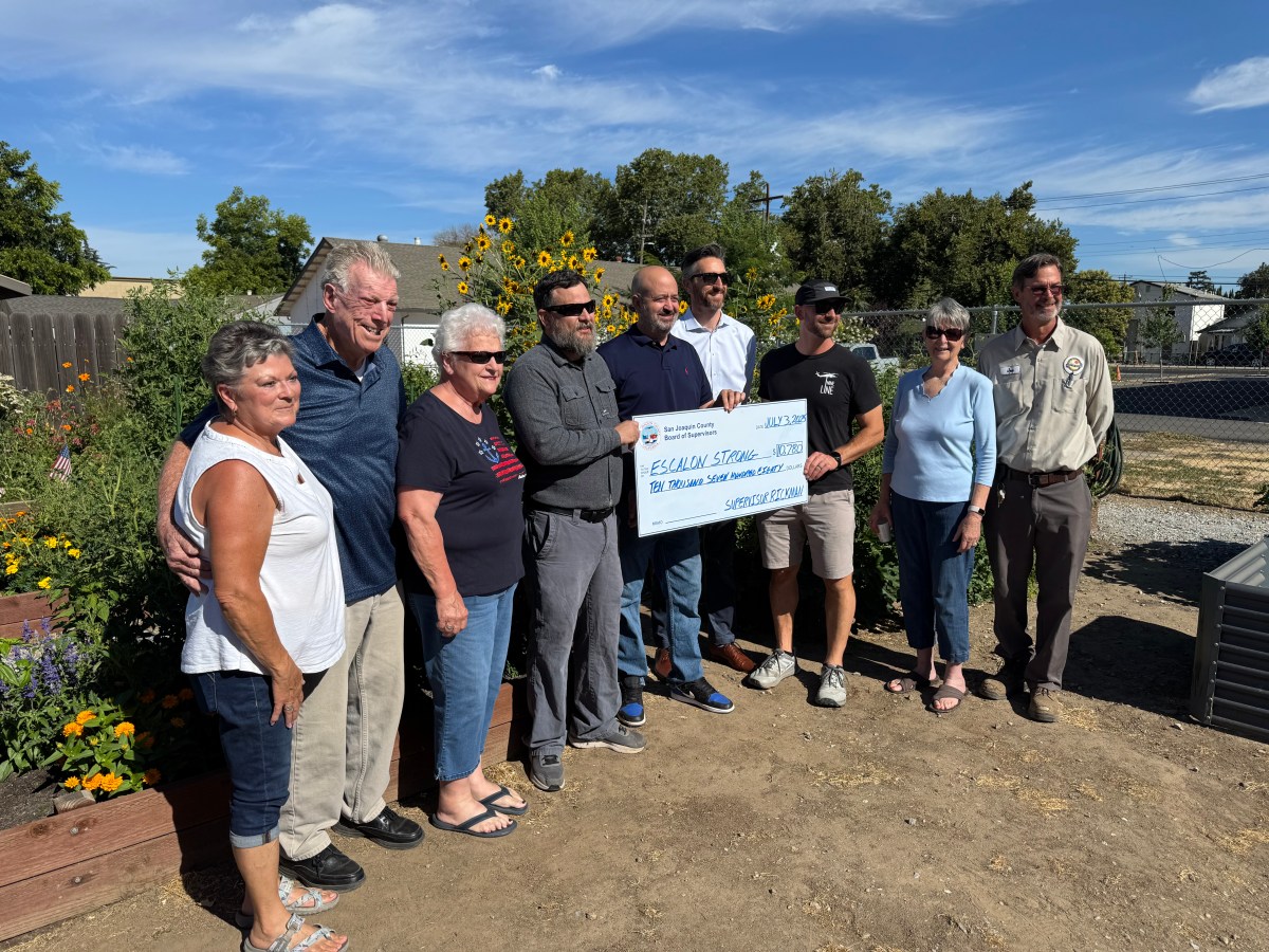 July 3 – Supervisor Rickman presents check  to Escalon Strong  at Community&nbsp;Garden